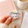 Cute Christian prayer sticker with colorful floral lettering, faith-inspired vinyl decal in cozy feminine workspace