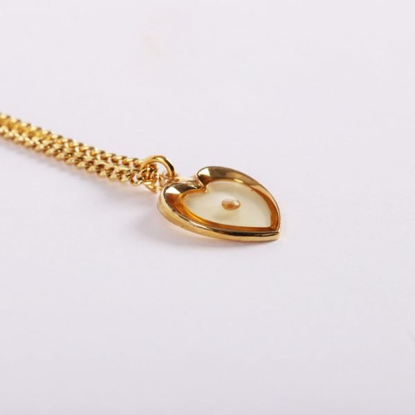 Mustard seed heart gold necklace placed in Majesty box
