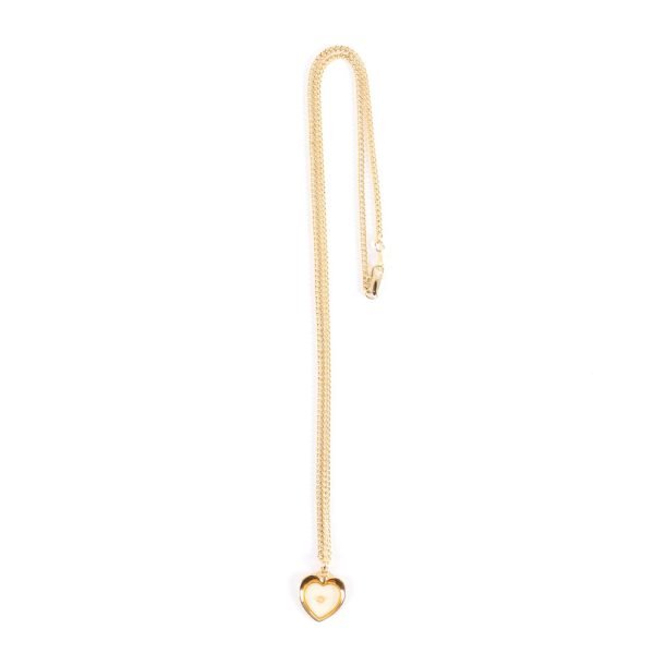 Mustard seed heart gold necklace placed in Majesty box