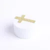 Gold cross with amazing grace written on it