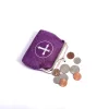 purple coin purse with cross inside the circle design