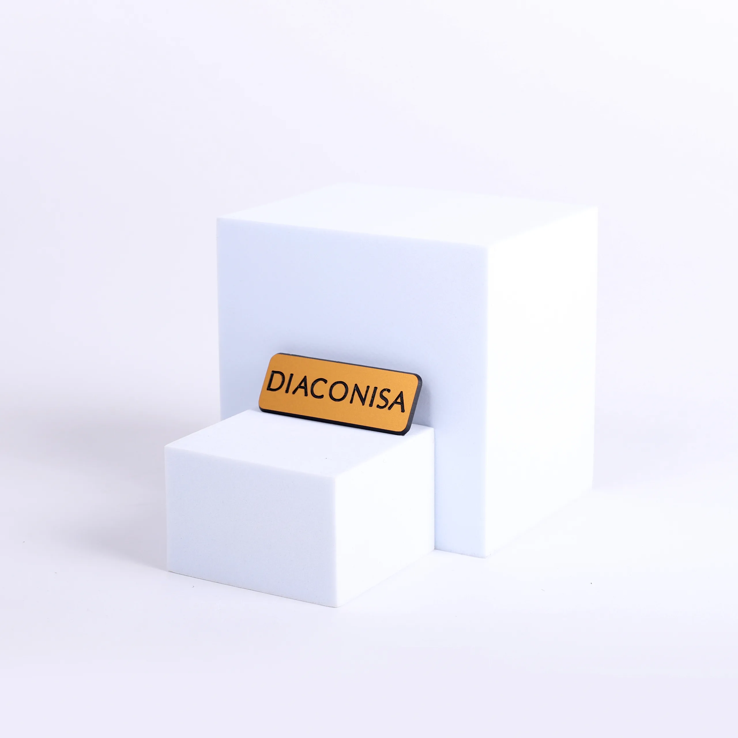 Engraved diaconisa gold pin front badge