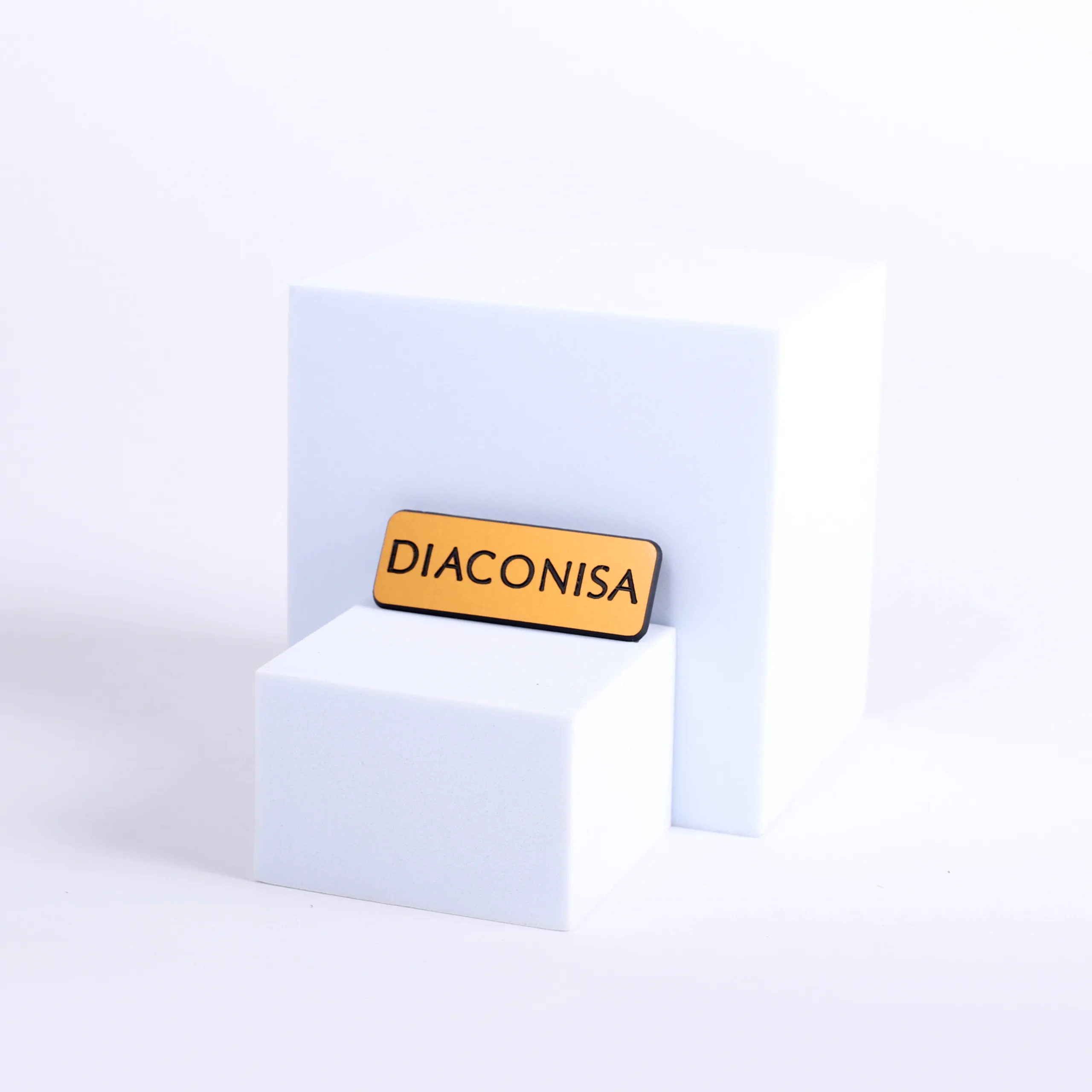 Engraved diaconisa gold pin front badge