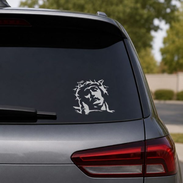 White Jesus portrait vinyl decal displayed on a vehicle rear window, featuring a stylized image of Christ wearing the crown of thorns.