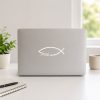 Silver laptop featuring a faith fish vinyl decal with the Christian Ichthys symbol and cursive “faith” lettering, creating a clean and meaningful expression of faith.