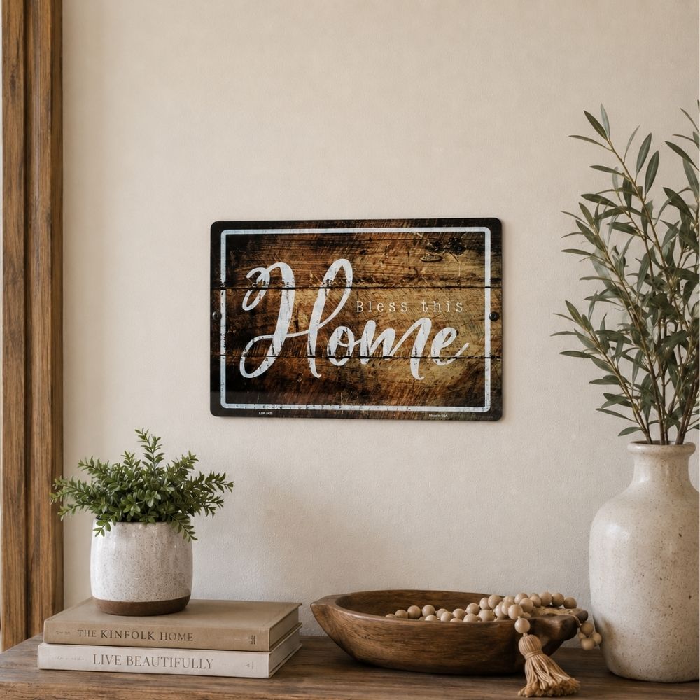 Bless This Home metal wall sign displayed above an entryway table, Christian farmhouse decor, faith-filled home decoration, religious wall art, inspirational family sign, rustic Christian home accent, welcoming faith-based decor.