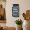 Christian kitchen wall decor featuring Bless the Food Before Us metal sign, farmhouse dining room decoration, faith-based kitchen art, family prayer sign, inspirational Christian home decor, religious wall plaque, kitchen blessing decor.