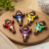 pocket cross and pocket jesus mix in variety of colors on a wooden table