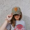 Girl wearing National park green Christian hat