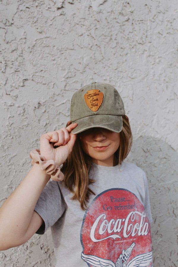Girl wearing National park green Christian hat