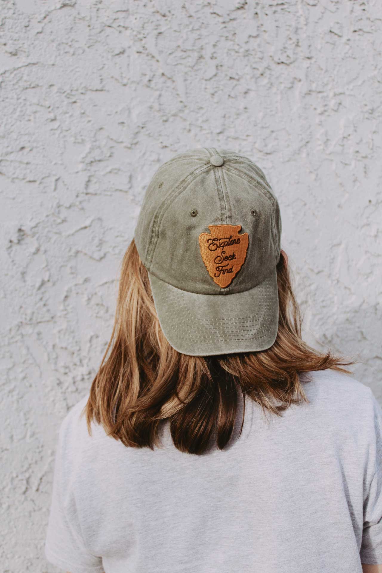 Explore seek find outdoorsy green and brown Christian hat swanson christian products