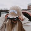 girl wearing forgiven christian neutral hat swanson Christian products