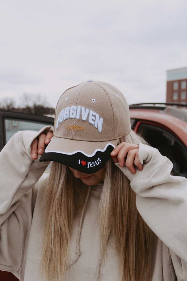 girl wearing forgiven christian neutral hat swanson Christian products