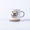 White latte mug with Kind honey bee on it