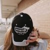 close up girl wearing One way Jesus the only way black hat Swanson christain