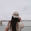 girl wearing front view Jesus is my boss tan hat Swanson christian products