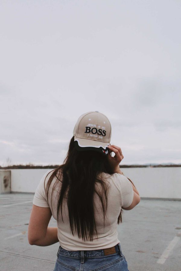 girl wearing front view Jesus is my boss tan hat Swanson christian products