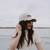 Girl wearing side view of Jesus is my boss hat swanson christian products