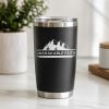 Black insulated tumbler featuring a white Unshakable Faith mountain-themed Christian vinyl decal, motivational faith-inspired drinkware design.