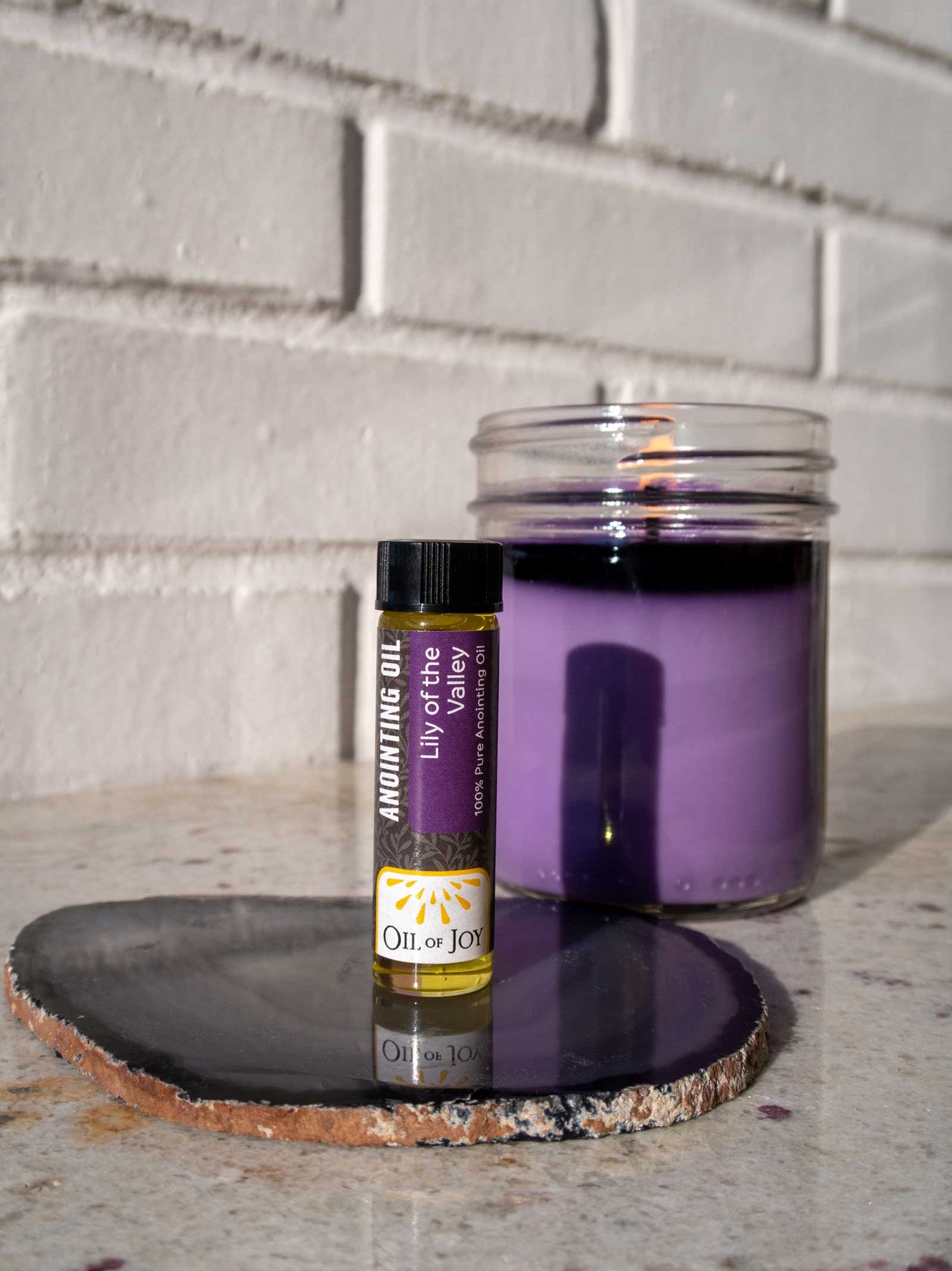 lily of the valley anointing oil in purple bottle- oil of joy