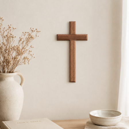 dark wall cross near table